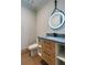 Modern powder room featuring an illuminated mirror, sleek vanity, and contemporary fixtures at 71 Ramey Rd, Sugar Hill, GA 30518