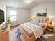 Cozy bedroom with a queen bed and neutral decor, virtually staged at 7526 Stone Creek Path, Lithonia, GA 30038