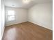 Bright bedroom with ample natural light and hardwood flooring at 7526 Stone Creek Path, Lithonia, GA 30038