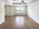 Large bedroom with hardwood floors and ample natural light at 7526 Stone Creek Path, Lithonia, GA 30038