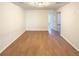 This is a bedroom with wood-look floors and neutral paint at 7526 Stone Creek Path, Lithonia, GA 30038