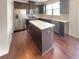 Modern kitchen featuring stainless steel appliances and a center island at 7526 Stone Creek Path, Lithonia, GA 30038