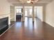 Spacious open-concept living area with hardwood floors and lots of natural light at 7526 Stone Creek Path, Lithonia, GA 30038