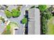 Birds-eye-view of well-maintained townhomes in a desirable community with mature trees, landscaping, and parking at 10898 Gallier St, Johns Creek, GA 30022