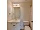 Traditional-style bathroom with vanity, mirror, and toilet at 10898 Gallier St, Johns Creek, GA 30022