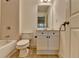 Cozy bathroom featuring vanity and tiled bathtub shower combo at 10898 Gallier St, Johns Creek, GA 30022