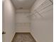 Walk-in closet with carpet flooring and wire shelving providing ample storage space at 10898 Gallier St, Johns Creek, GA 30022