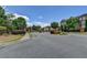 A gated entrance to a neighborhood surrounded by manicured landscaping and townhomes at 10898 Gallier St, Johns Creek, GA 30022
