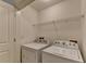 Laundry room with side-by-side washer and dryer at 10898 Gallier St, Johns Creek, GA 30022