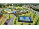 An aerial view of the neighborhood playground, basketball court, and picnic pavilions at 10898 Gallier St, Johns Creek, GA 30022