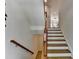 Carpeted staircase with wooden railings at 10898 Gallier St, Johns Creek, GA 30022