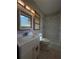 Updated bathroom featuring a shower-tub combo, a vanity sink, and modern fixtures at 237 Sandra Nw Dr, Lilburn, GA 30047
