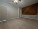 Bedroom featuring tiled floors, natural lighting and paneled accent wall at 237 Sandra Nw Dr, Lilburn, GA 30047