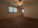 Bedroom with carpeting, a ceiling fan and a closet with mirror doors at 237 Sandra Nw Dr, Lilburn, GA 30047