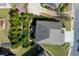 Aerial view of home showcasing the roof, driveway, and surrounding landscaped yard and neighborhood at 2906 Ansley Manor Ct, Marietta, GA 30062