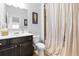 Bathroom with a dark wood vanity and a shower with a patterned shower curtain at 2906 Ansley Manor Ct, Marietta, GA 30062