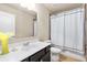 Neutral bathroom with a white vanity, sink, mirror, and a shower-tub combo at 2906 Ansley Manor Ct, Marietta, GA 30062