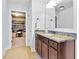 Bathroom vanity featuring granite countertop and a door to a walk-in closet at 2906 Ansley Manor Ct, Marietta, GA 30062