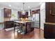 Kitchen boasting dark wood cabinetry, granite countertops, and stainless steel appliances at 2906 Ansley Manor Ct, Marietta, GA 30062