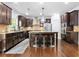 The spacious kitchen includes an island with seating and stainless steel appliances set against a backdrop of custom cabinetry at 2906 Ansley Manor Ct, Marietta, GA 30062