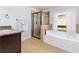 Beautiful bathroom featuring a stand up shower, soaking tub, and granite countertop vanity at 2906 Ansley Manor Ct, Marietta, GA 30062