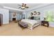 Spacious main bedroom with carpet floors, tray ceilings, a fireplace, and large windows at 2906 Ansley Manor Ct, Marietta, GA 30062