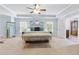 Spacious main bedroom with tray ceilings, carpet floors, three mirrors, and large windows at 2906 Ansley Manor Ct, Marietta, GA 30062
