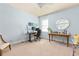 Bright home office with a desk and large windows at 2906 Ansley Manor Ct, Marietta, GA 30062