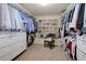 Large walk-in closet with custom shelving, drawers, and racks for ample storage space at 2906 Ansley Manor Ct, Marietta, GA 30062