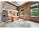 Kitchen and Living space featuring stainless steel appliances and large windows at 350 Peters Sw St # 6, Atlanta, GA 30313