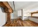 Open living area with hardwood floors, exposed wooden beams, and lots of natural light at 350 Peters Sw St # 6, Atlanta, GA 30313