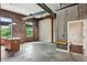 Spacious living room with brick walls, concrete floors, and an island at 350 Peters Sw St # 6, Atlanta, GA 30313