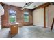 Spacious living room with brick walls, concrete floors, and an island at 350 Peters Sw St # 6, Atlanta, GA 30313