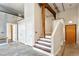 Stairway leading up to the next level with a hallway and two doorways at 350 Peters Sw St # 6, Atlanta, GA 30313