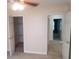 The bedroom has a ceiling fan and two doors to other rooms at 3416 N Cook Rd, Powder Springs, GA 30127