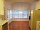 Dining area featuring lots of natural light, view to the backyard, and adjacent to the kitchen at 3416 N Cook Rd, Powder Springs, GA 30127