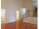 Bright living room with hardwood floors and staircase to the second floor at 3416 N Cook Rd, Powder Springs, GA 30127