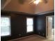 Spacious bedroom featuring a ceiling fan, neutral carpet, and access to the ensuite bathroom at 3416 N Cook Rd, Powder Springs, GA 30127