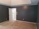 Main bedroom featuring an ensuite bathroom and neutral carpet at 3416 N Cook Rd, Powder Springs, GA 30127