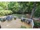 Spacious backyard featuring a wooden deck with outdoor seating and a lush green lawn with mature trees at 825 Loridans Ne Cir, Atlanta, GA 30342