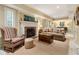 Basement living area with a fireplace, comfortable seating, and neutral color palette at 825 Loridans Ne Cir, Atlanta, GA 30342