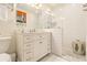 Bright bathroom featuring a white vanity with marble countertop and a tiled walk-in shower at 825 Loridans Ne Cir, Atlanta, GA 30342