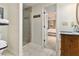 En-suite bathroom with glass shower, tiled floors, and a view into the bedroom at 825 Loridans Ne Cir, Atlanta, GA 30342