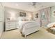 Bright bedroom featuring a white bed, neutral walls, and a window with sheer curtains at 825 Loridans Ne Cir, Atlanta, GA 30342