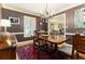 Elegant dining room with wood floors, a chandelier, and a large wood table at 825 Loridans Ne Cir, Atlanta, GA 30342