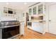 Well-appointed kitchen with white cabinets, stainless steel appliances, and granite countertops at 825 Loridans Ne Cir, Atlanta, GA 30342