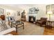 Inviting living room featuring hardwood floors, a cozy fireplace, and tasteful decor at 825 Loridans Ne Cir, Atlanta, GA 30342