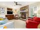 Comfortable living room with a brick fireplace, hardwood floors, and plenty of seating at 825 Loridans Ne Cir, Atlanta, GA 30342