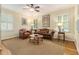 Comfortable living room featuring plantation shutters, hardwood floors, and neutral tones at 825 Loridans Ne Cir, Atlanta, GA 30342