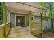 Spacious wooden back deck with railings and a covered area at 832 Wyntuck Nw Dr, Kennesaw, GA 30152